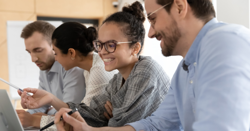 Happy coworkers discuss turnover rate