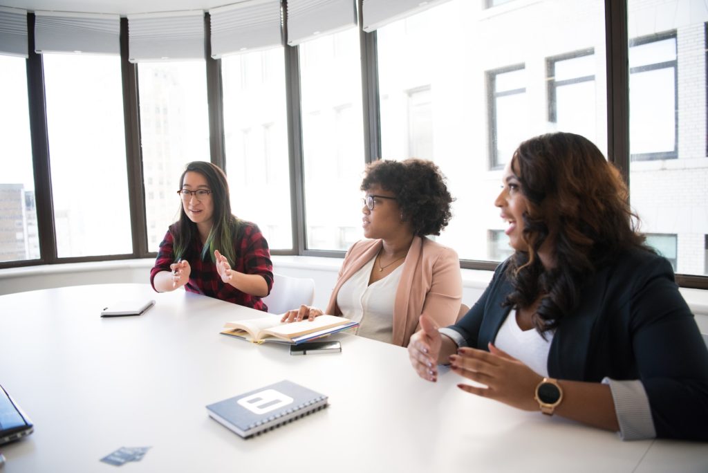 Three women of colour discussing culture strategy