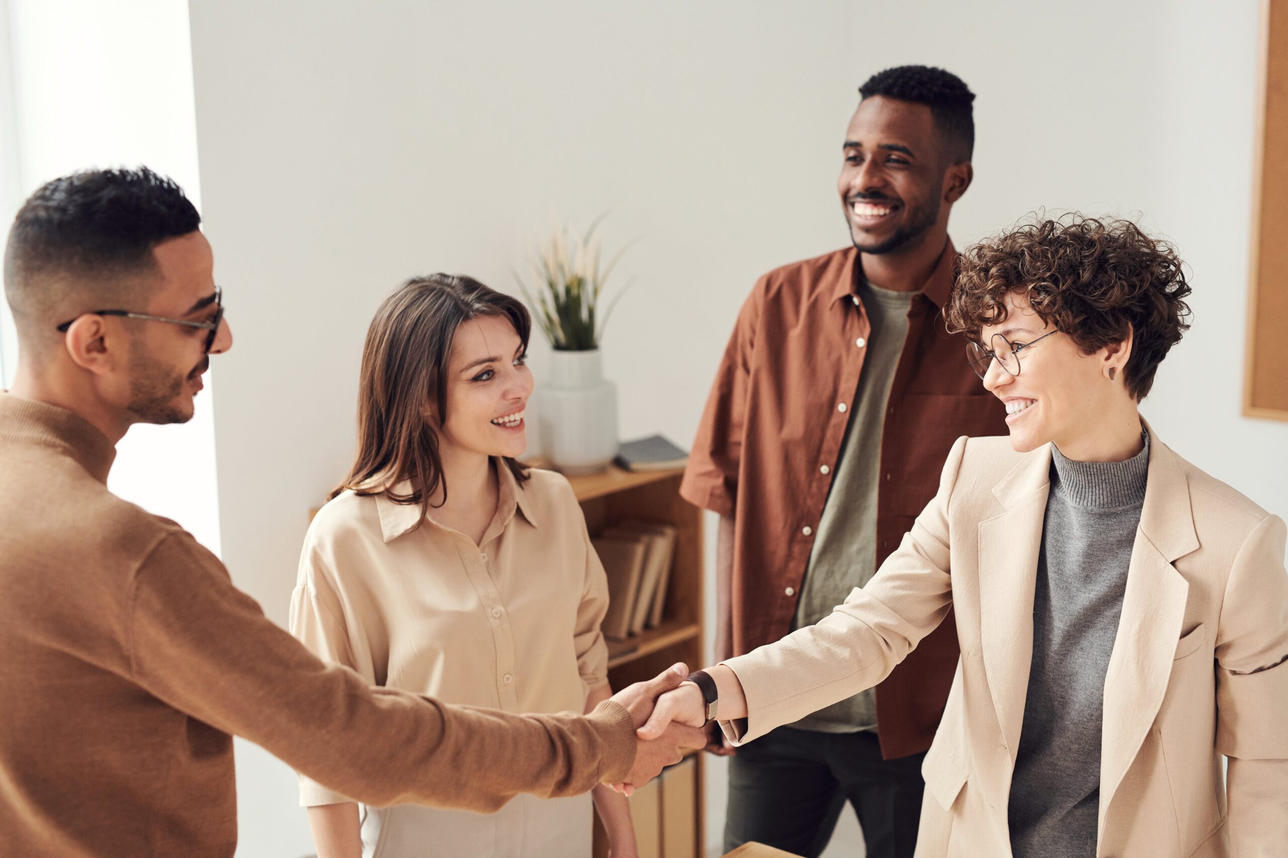 photo-of-people-doing-handshakes HR professionals meeting with employees to assess employee well-being