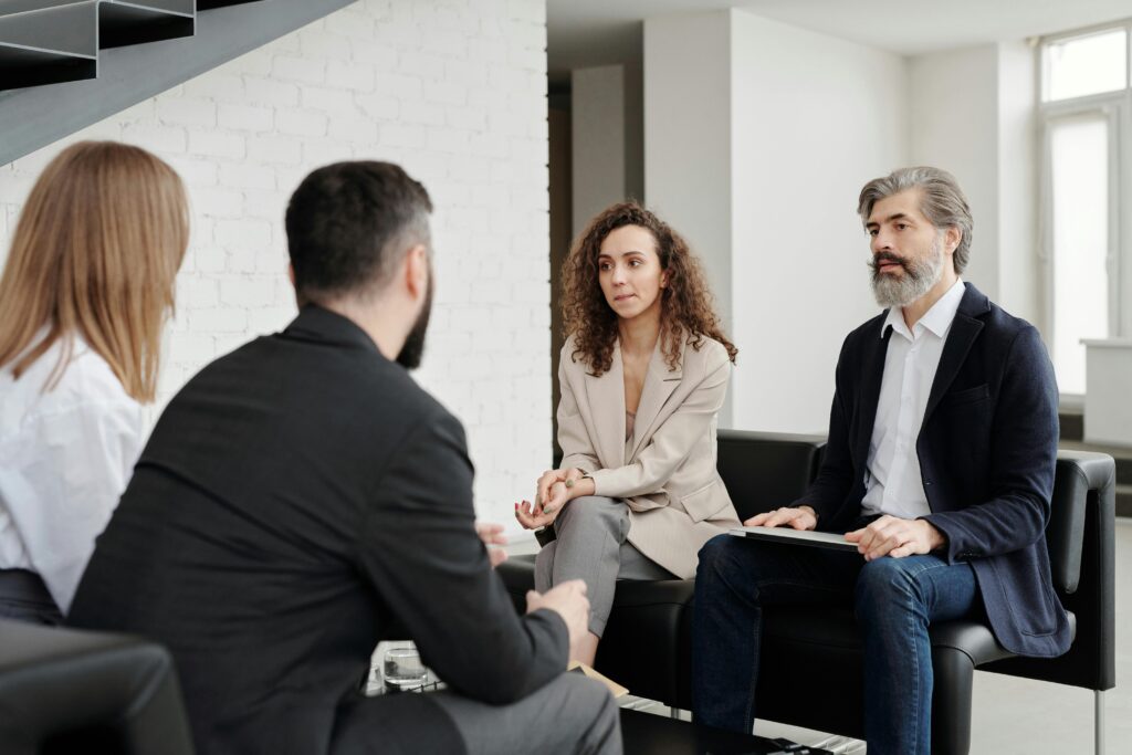 Leadership meeting with their employees to gauge their well-being