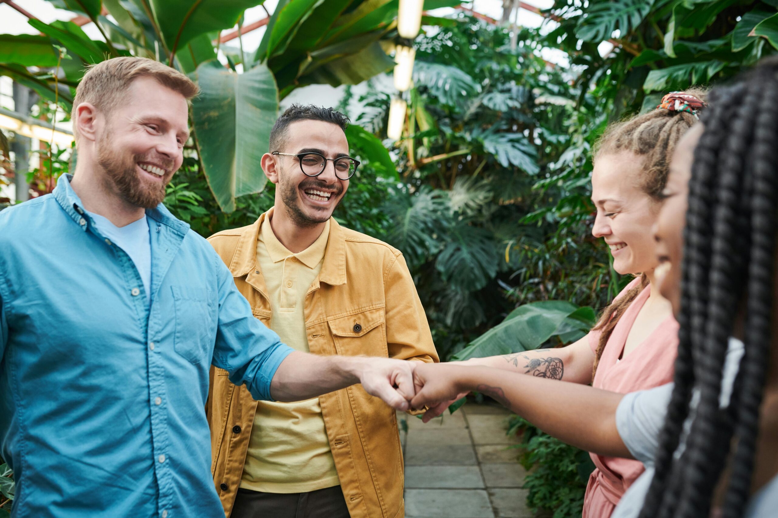 People-Having-Fist-Bump Photo Of People Having Fist Bump