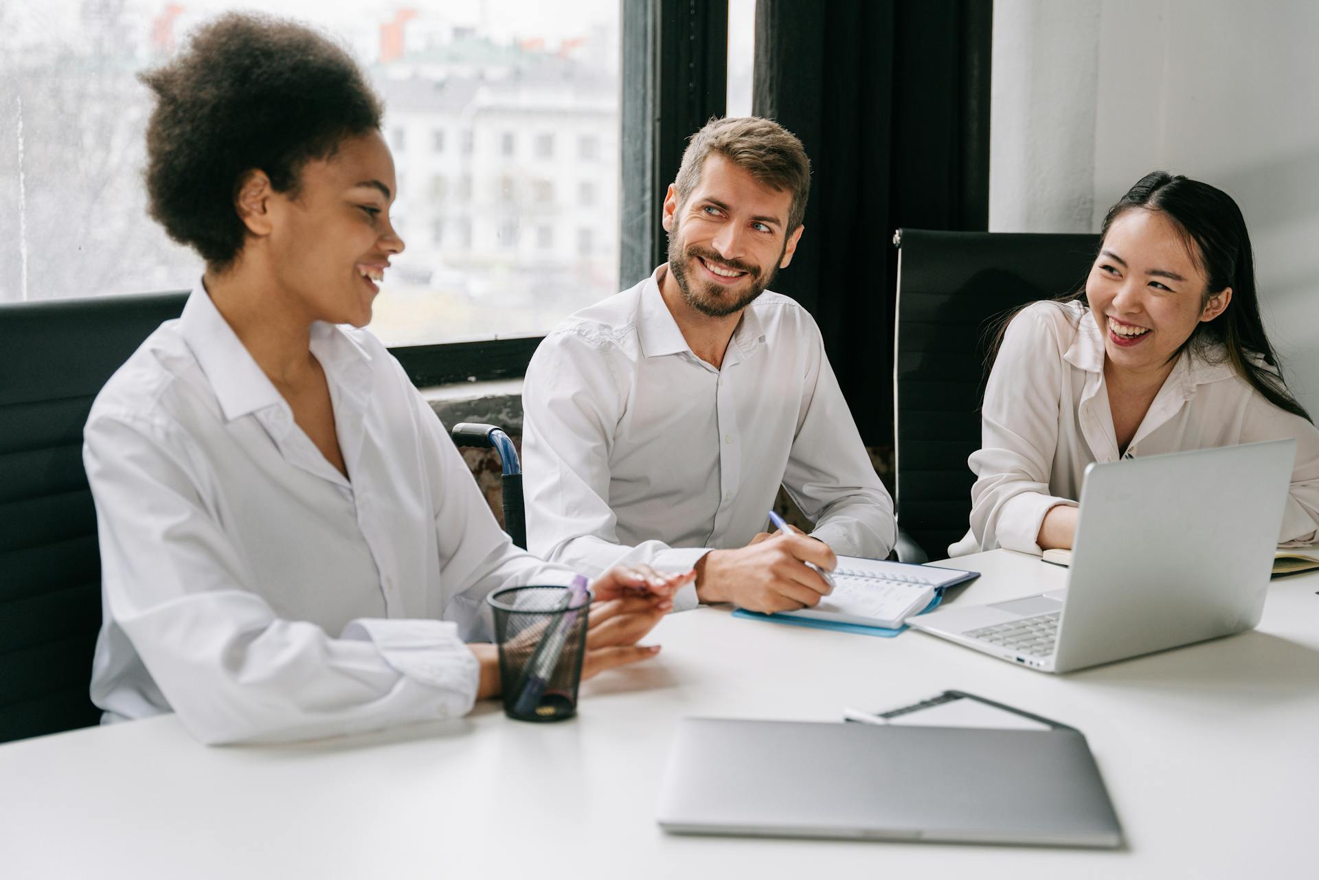 man and women at desk talking