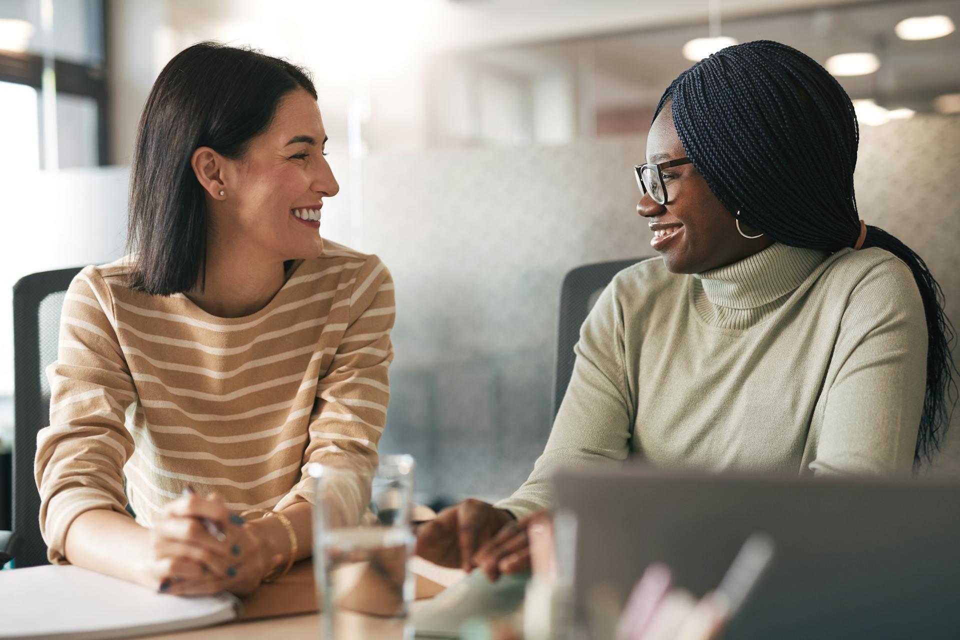 two female colleagues sharing feedback
