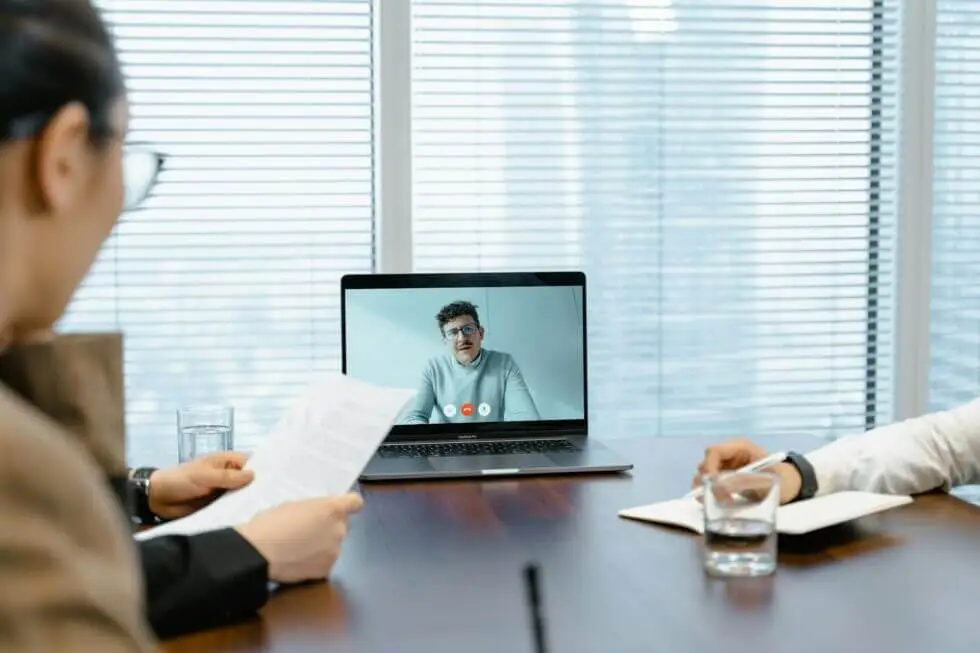 Remote meeting with team in office and manager at home